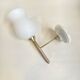 Pair of brass torch wall lights with white opal glass and porcelain