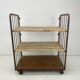 Vintage industrial iron and wood shelves on wheels