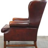 Beautiful classic and stately wingback armchair made of sheep leather with beautiful colors