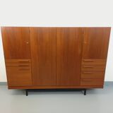 High Scandinavian modernist vintage sideboard in teak and black metal.
