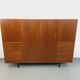 High Scandinavian modernist vintage sideboard in teak and black metal.