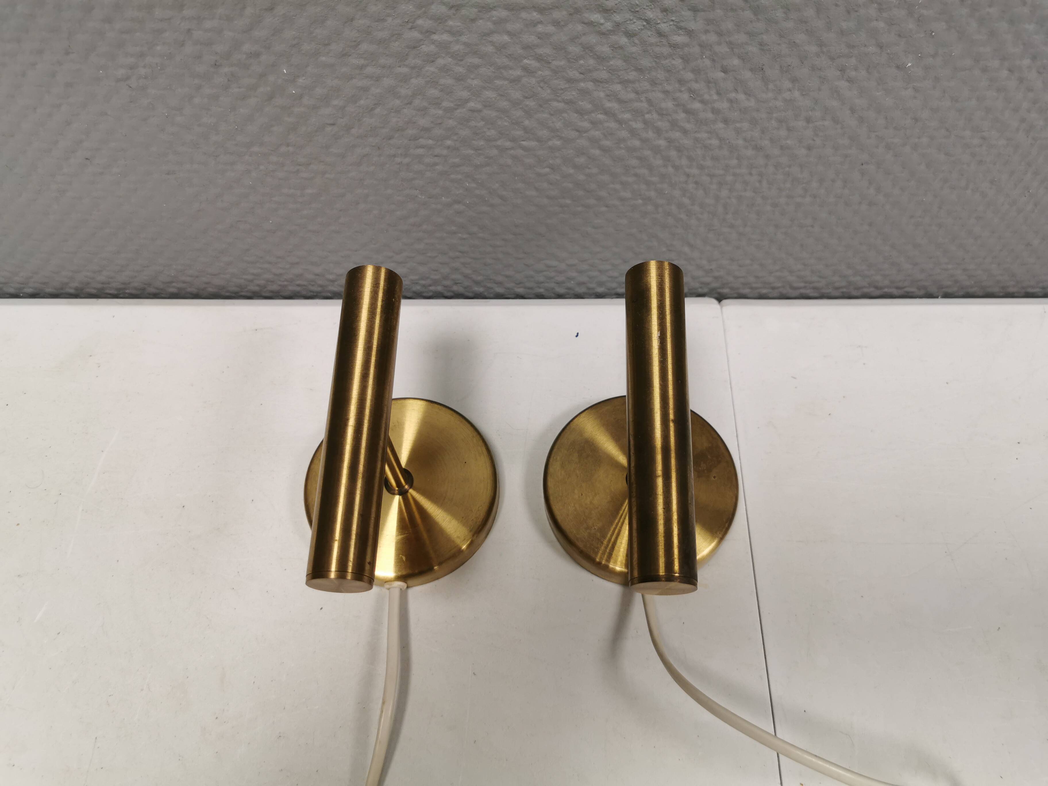 A set of stylish brass wall lamps from Danish Darø