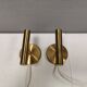 A set of stylish brass wall lamps from Danish Darø