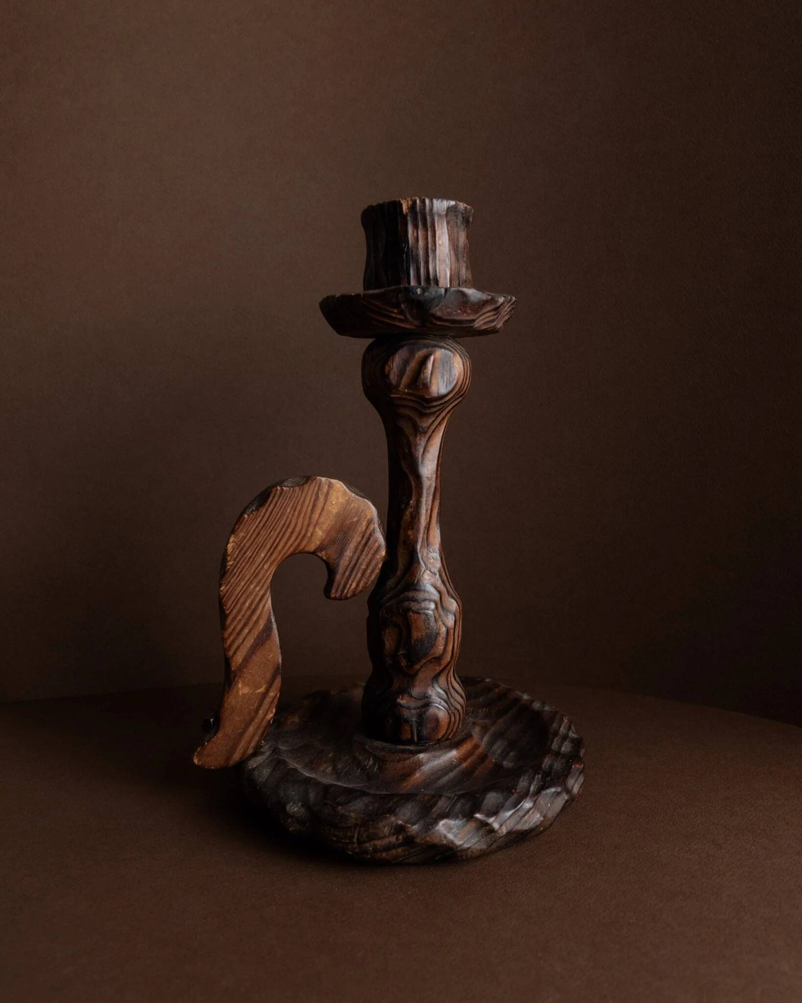 Brutalist carved wood candle holder, dark brown with lighter highlights, made in Italy, 1940s