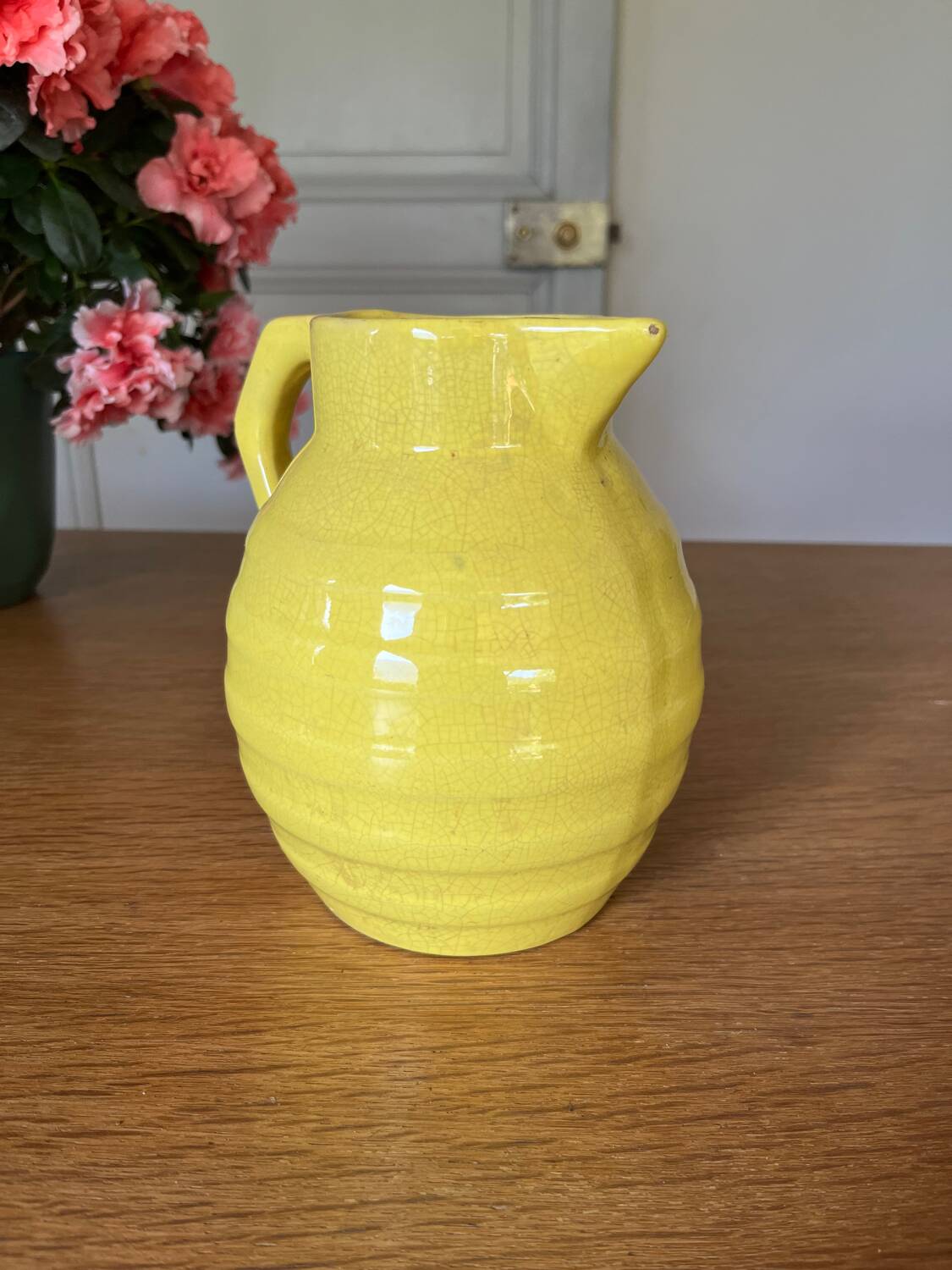 Old yellow ceramic pitcher