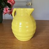 Old yellow ceramic pitcher