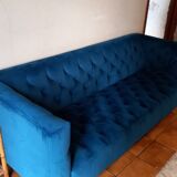 Royal blue velvet upholstered sofa