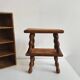 Pair of stools, footrests in solid turned wood