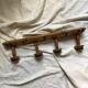 Antique wall-mounted coat rack in turned bamboo-style wood