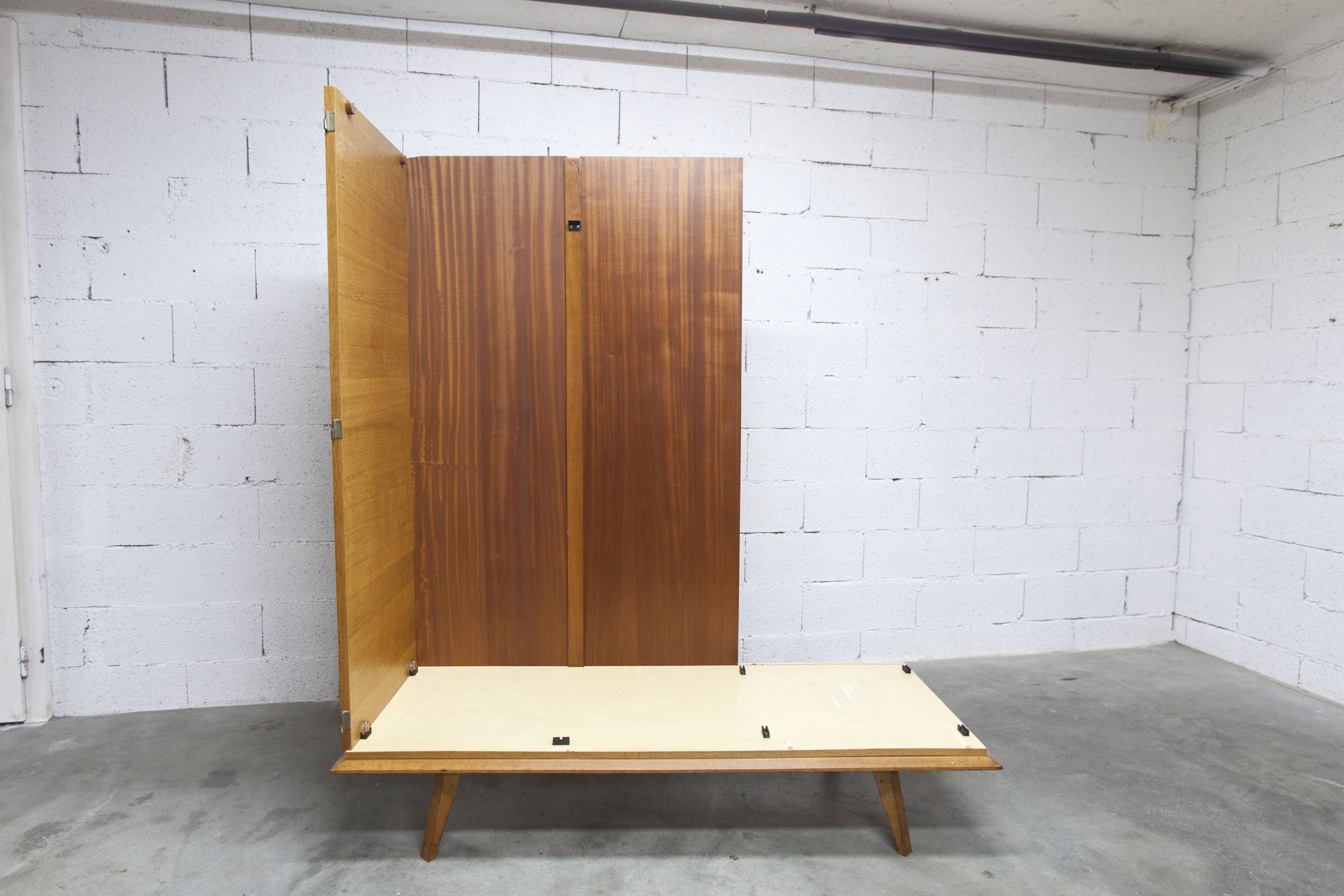 French wardrobe with tapered legs, 3 doors, 1 mirror (27*130), and 1 drawer.