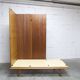 French wardrobe with tapered legs, 3 doors, 1 mirror (27*130), and 1 drawer.