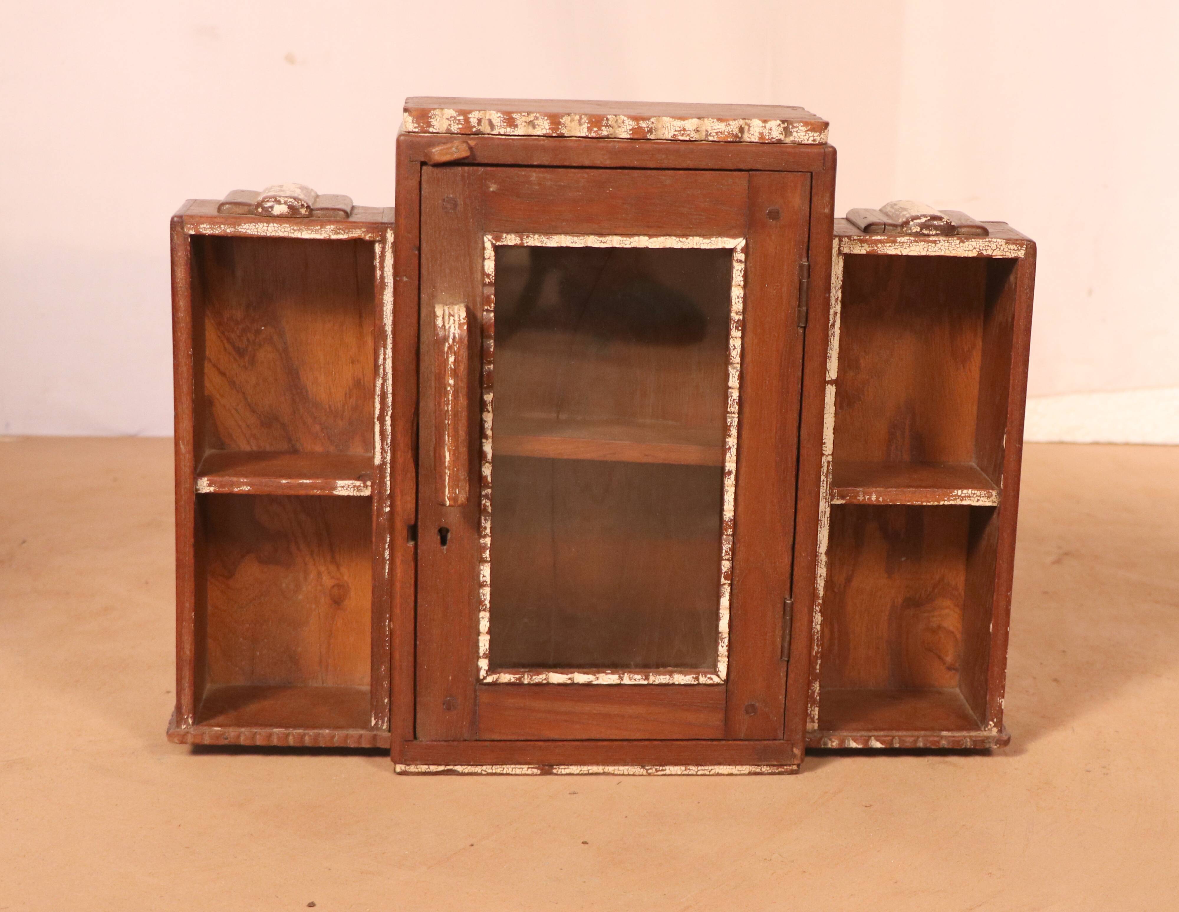 Old art deco showcase in burmese teak with original white edging