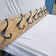 Teak coat rack with 8 double cast iron hooks