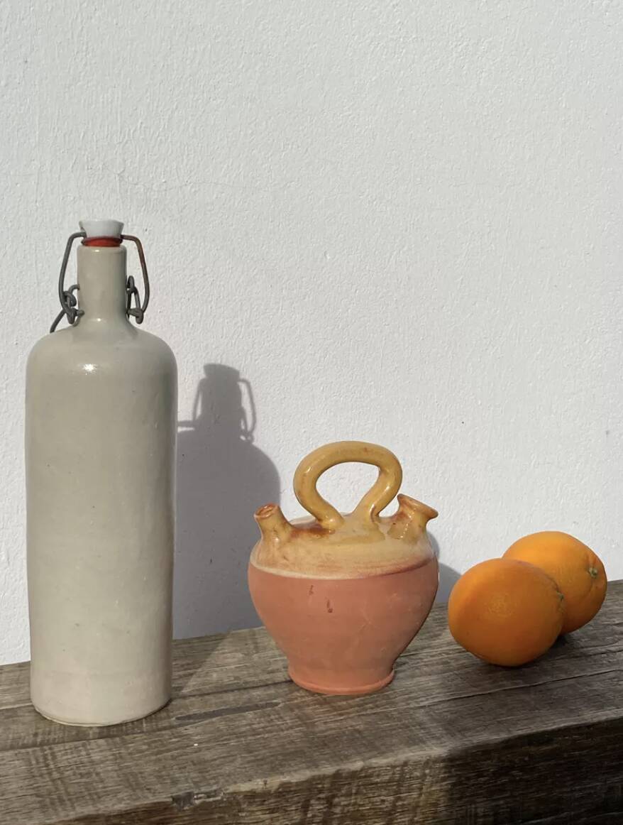 Gargoulette or old jug in yellow glazed terracotta