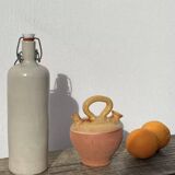 Gargoulette or old jug in yellow glazed terracotta