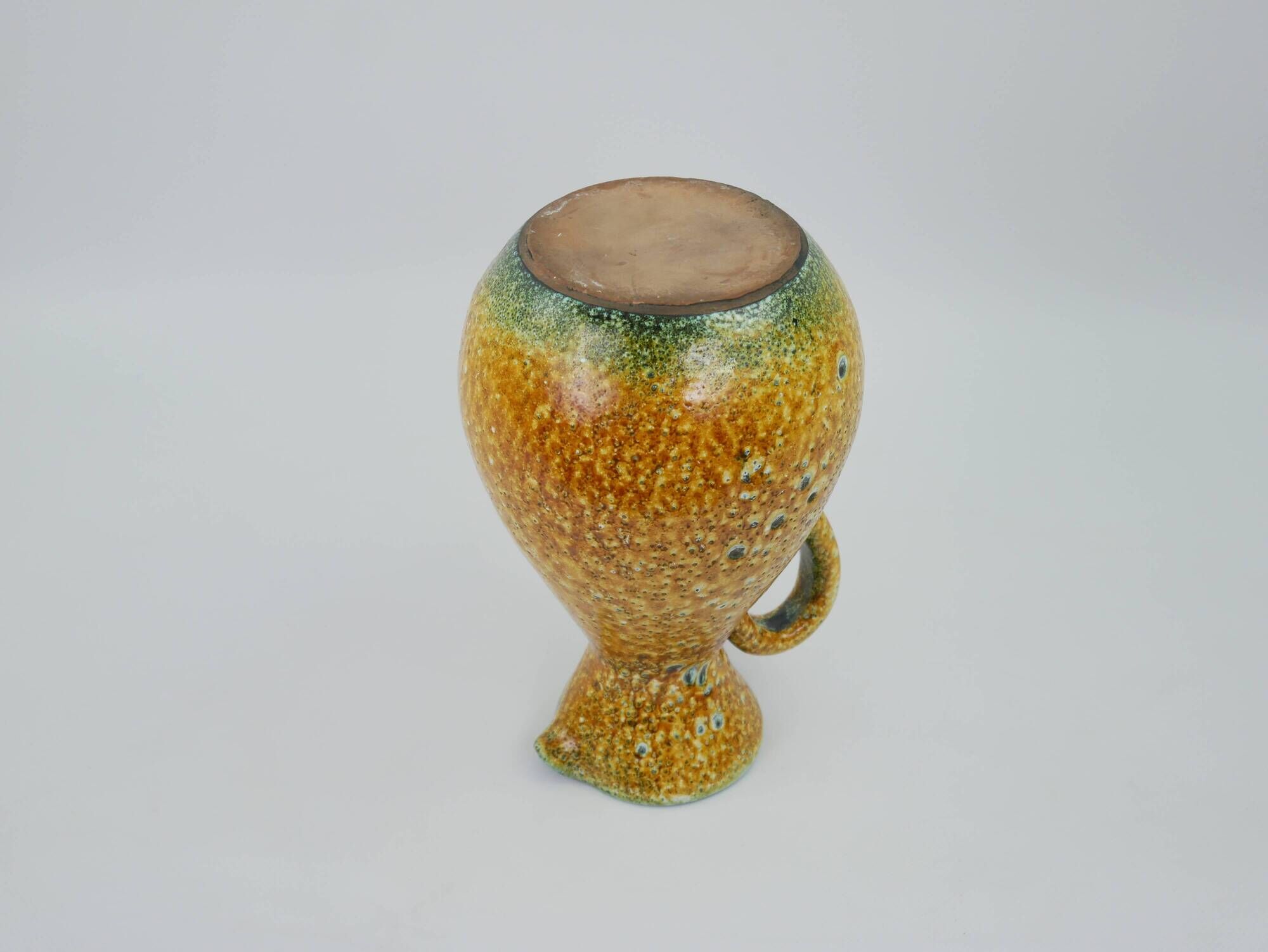 Large yellow ceramic pitcher in the Accolay style
