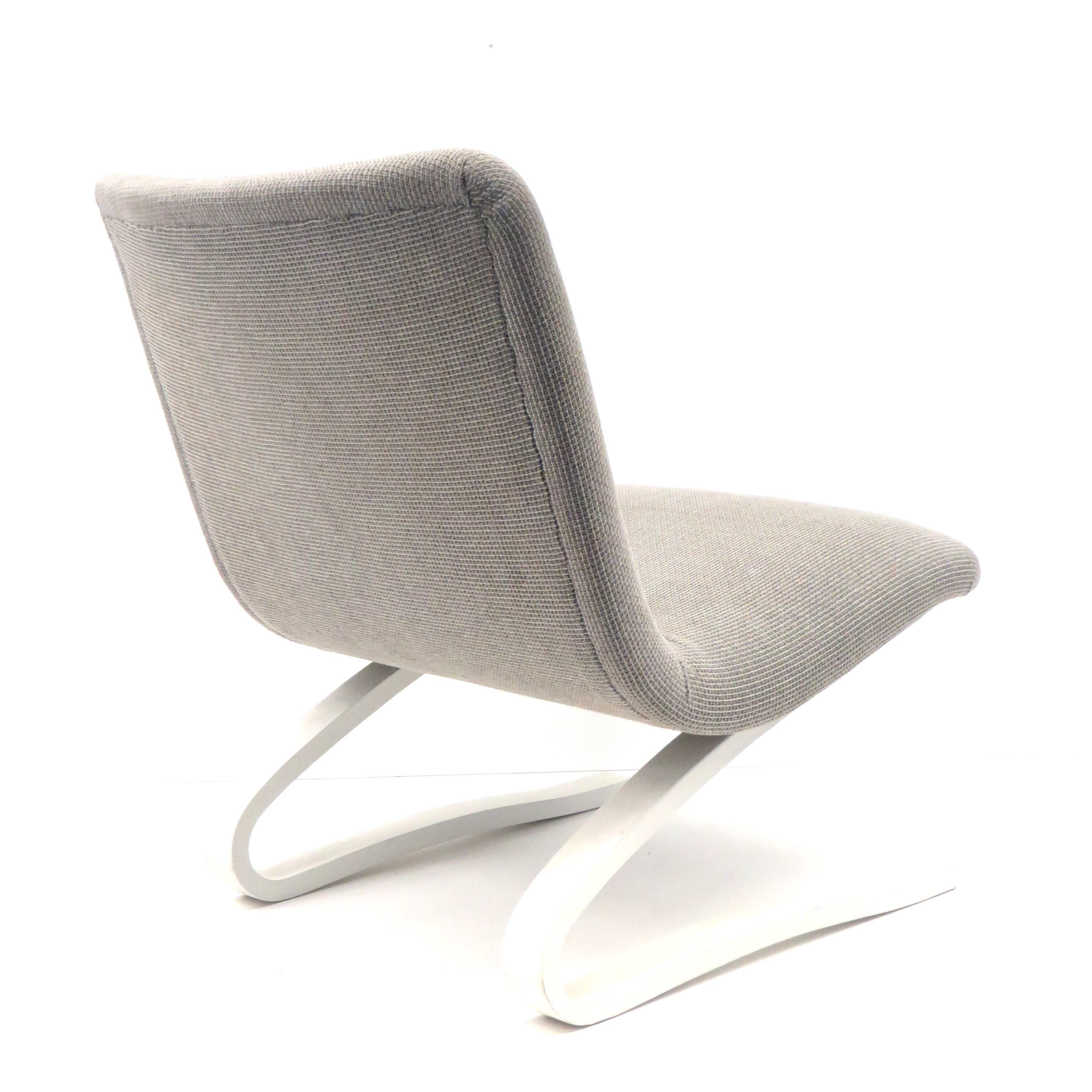 Vintage armchair with white bouncy wooden base made in the 70s