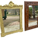 Two antique 19th century mirrors in carved Napoleon oak wood
