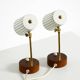 A pair of mid-century modern bedside lamps with perforated metal shades
