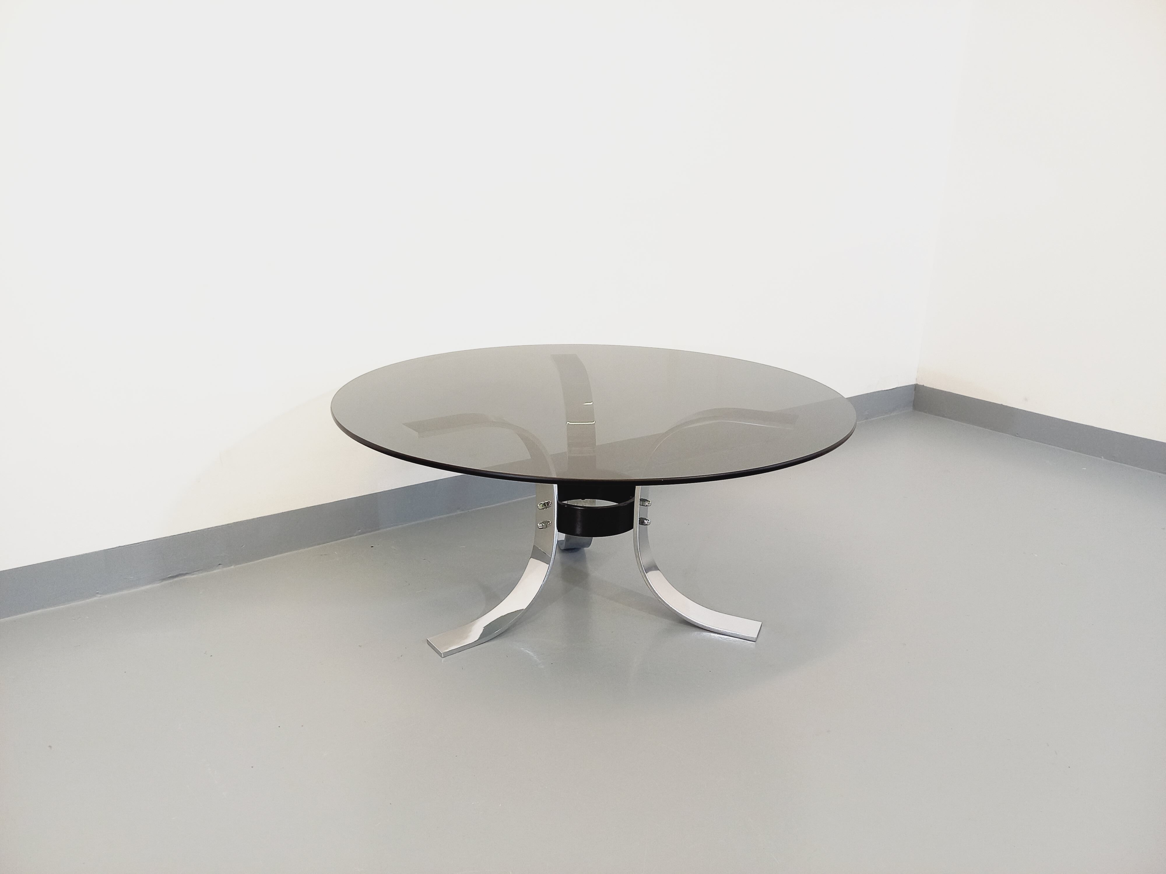 Vintage round coffee table in glass, chromed metal and black metal Space Age style of the 70s