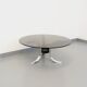 Vintage round coffee table in glass, chromed metal and black metal Space Age style of the 70s