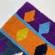 Off-white Moroccan rug with colorful patterns, 250cm x 150cm