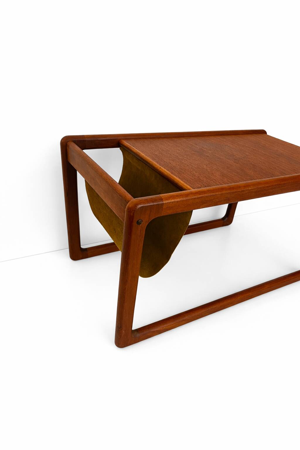 Danish teak coffee table with magazine rack by Kai Kristiansen.