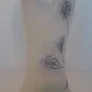 Frosted glass vase enhanced by hand