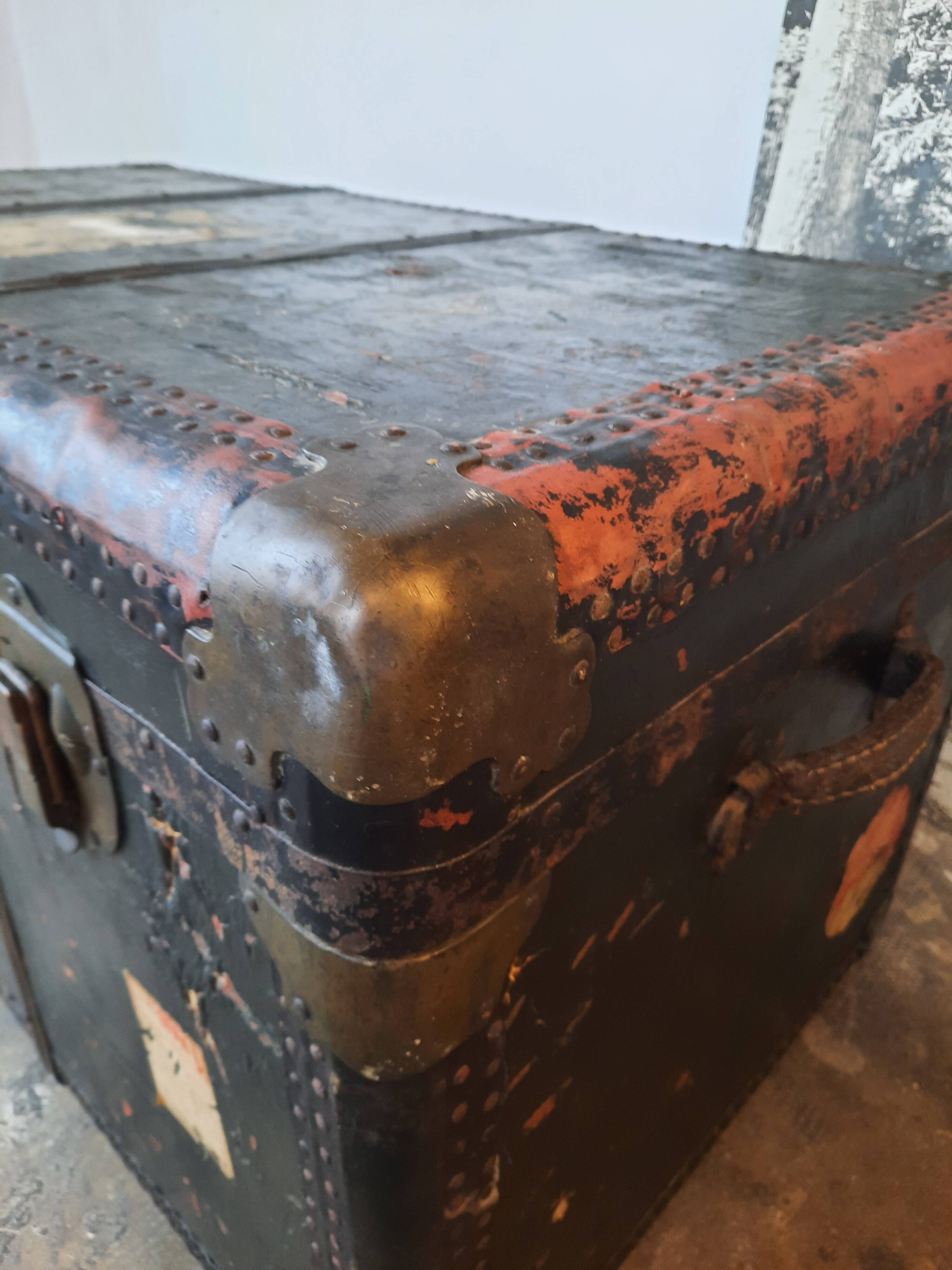 Old and large travel trunk, brass-plated corners