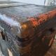 Old and large travel trunk, brass-plated corners