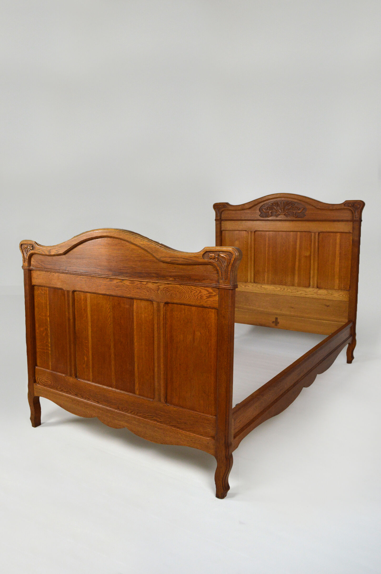 Art Nouveau twin beds in carved solid oak, France, circa 1910