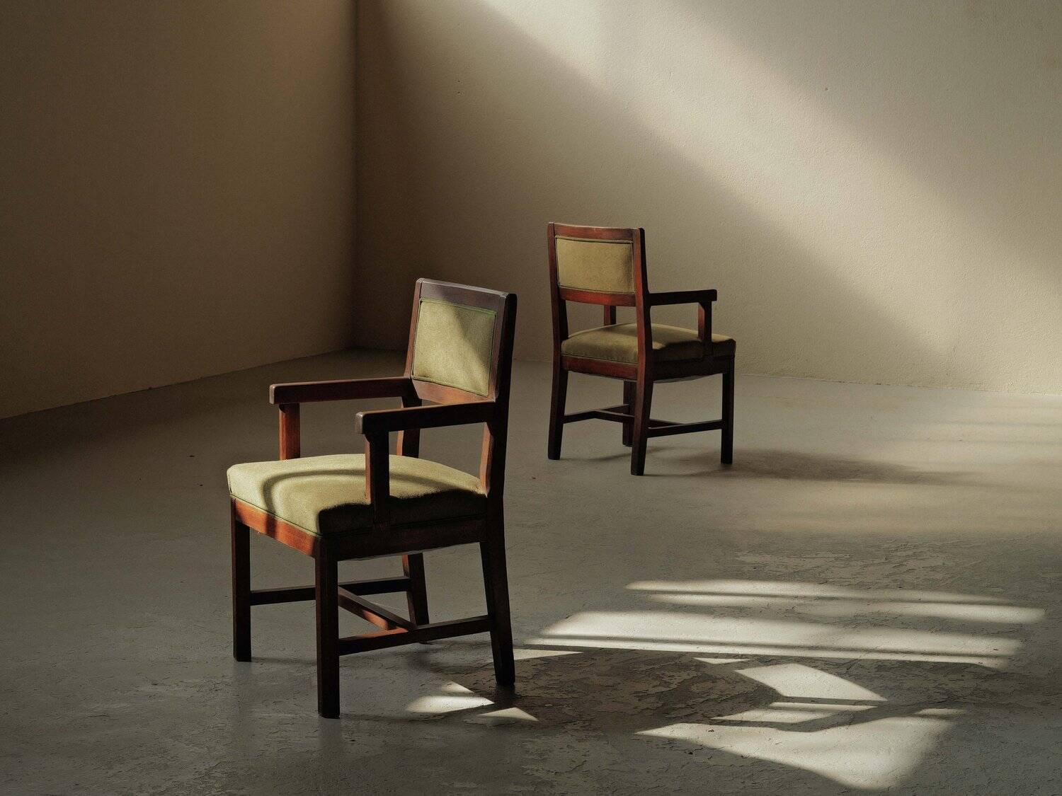 Pair of modernist armchairs in solid oak, France, circa 1940.