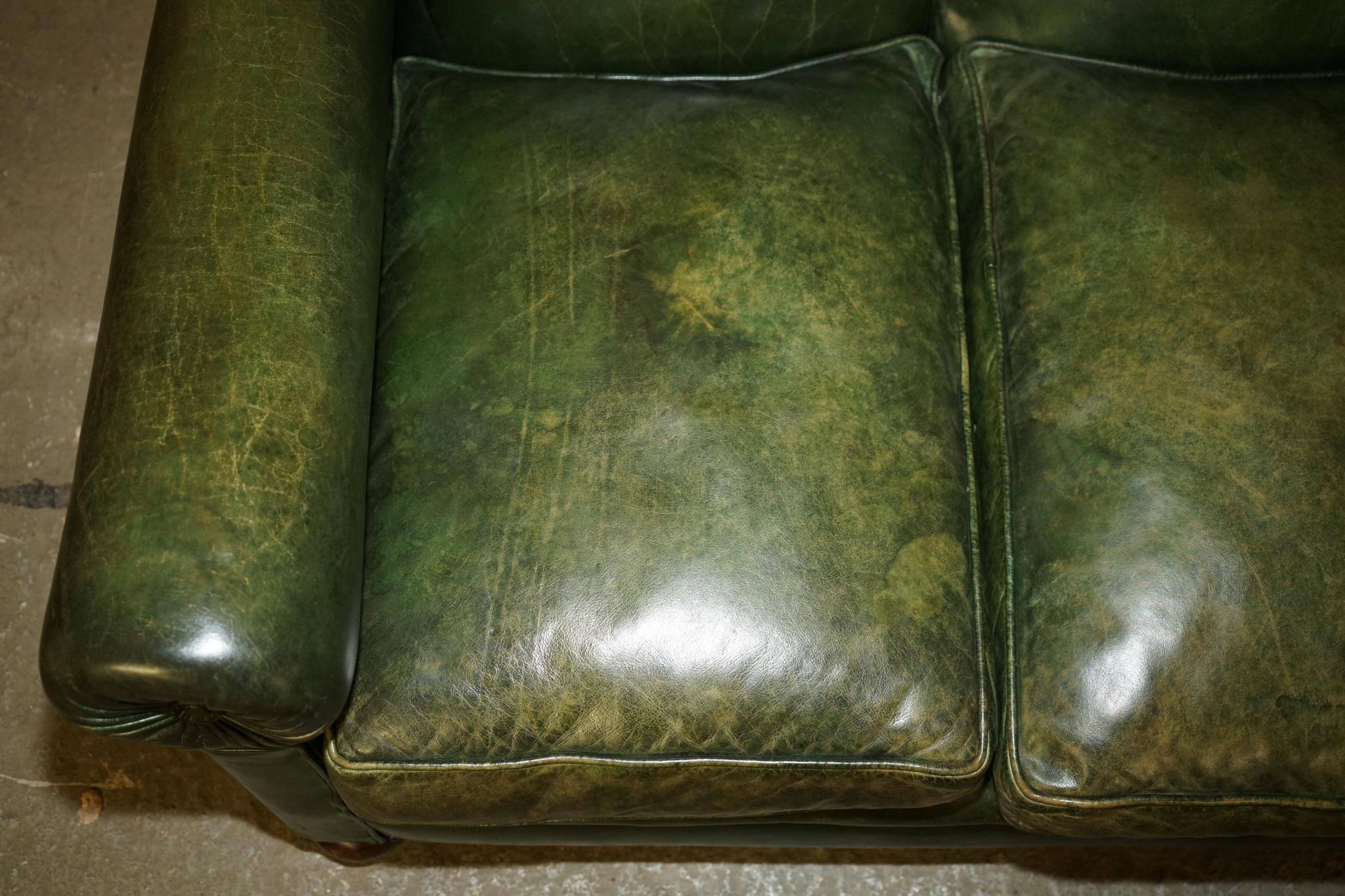 Victorian leather canapé, shield armrests, stamped Maple & Co.