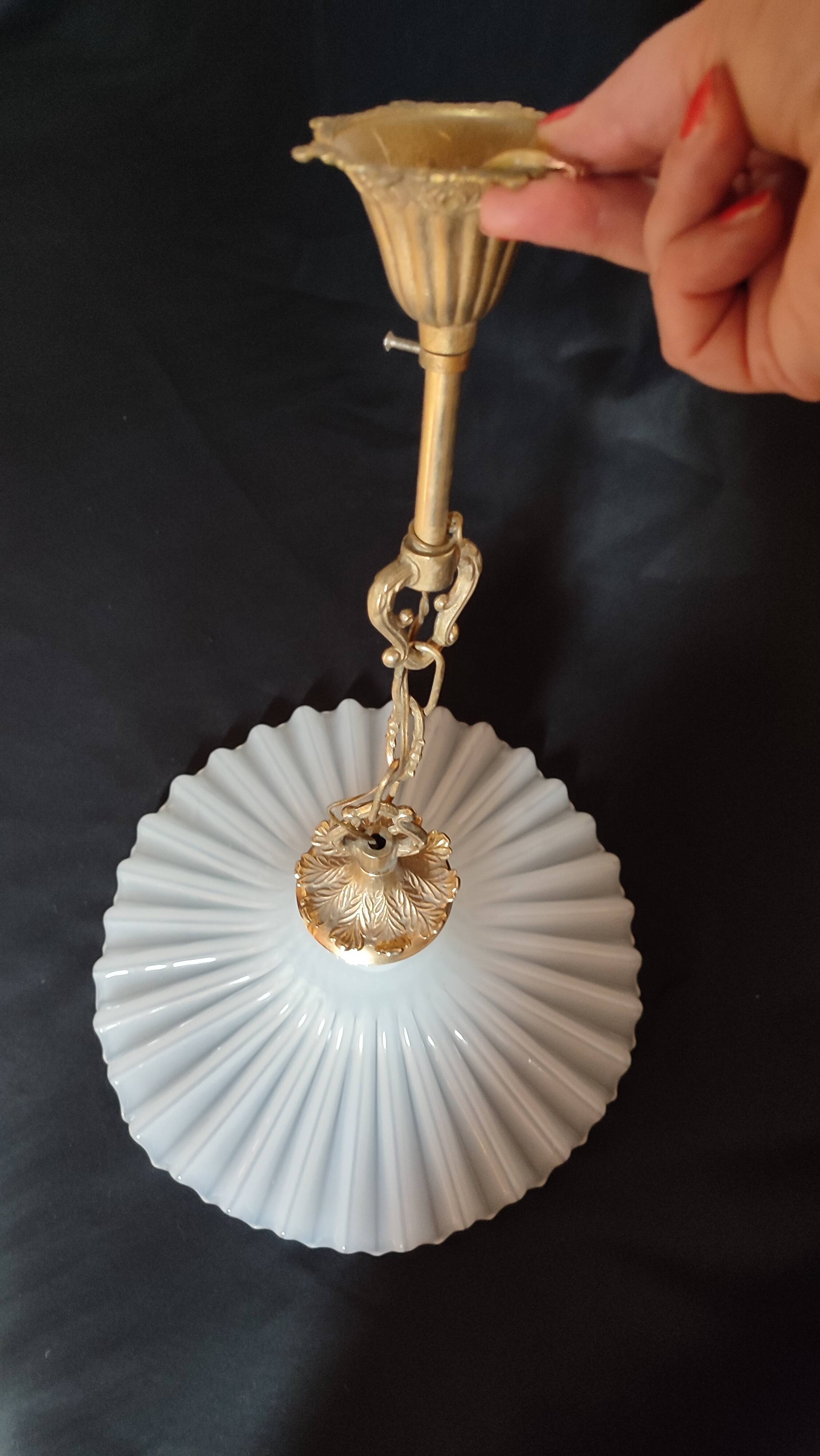 Round pendant light in pleated semi-opaque glass