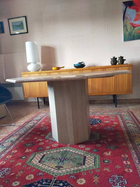 Octagonal dining table in travertine