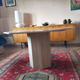 Octagonal dining table in travertine