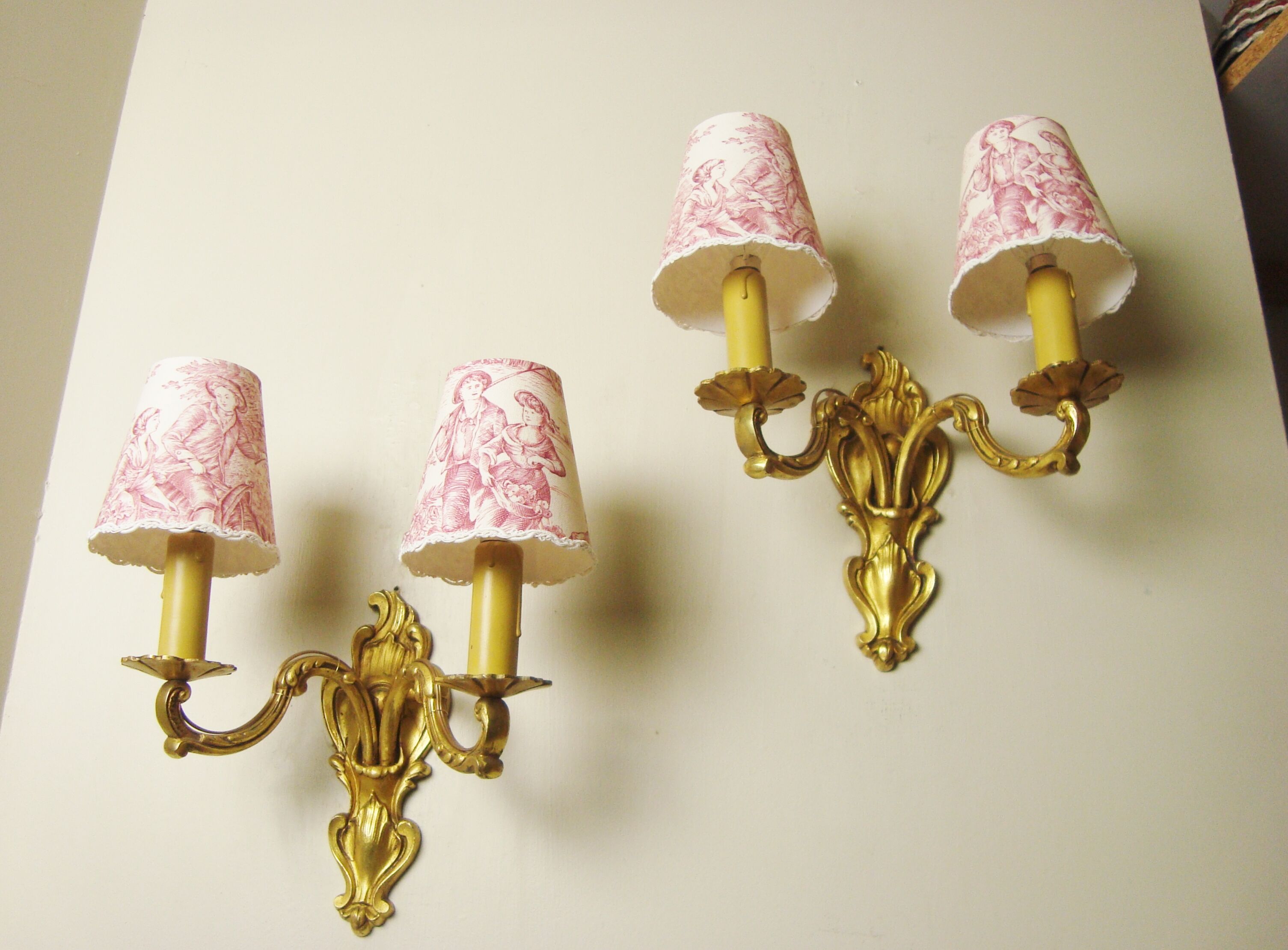 Pair of bronze sconces with four handmade toile de Jouy lampshades in France