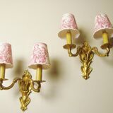 Pair of bronze sconces with four handmade toile de Jouy lampshades in France