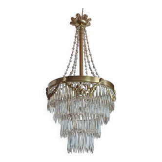 Antique crystal chandelier with cut glass pendants from the Napoleonic III period.