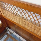 Vintage oak and rattan baby cot from the 1960s.
