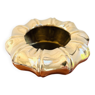 Golden brass ashtray with bamboo decoration.