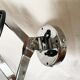 Vintage accordion wall light in chrome metal.