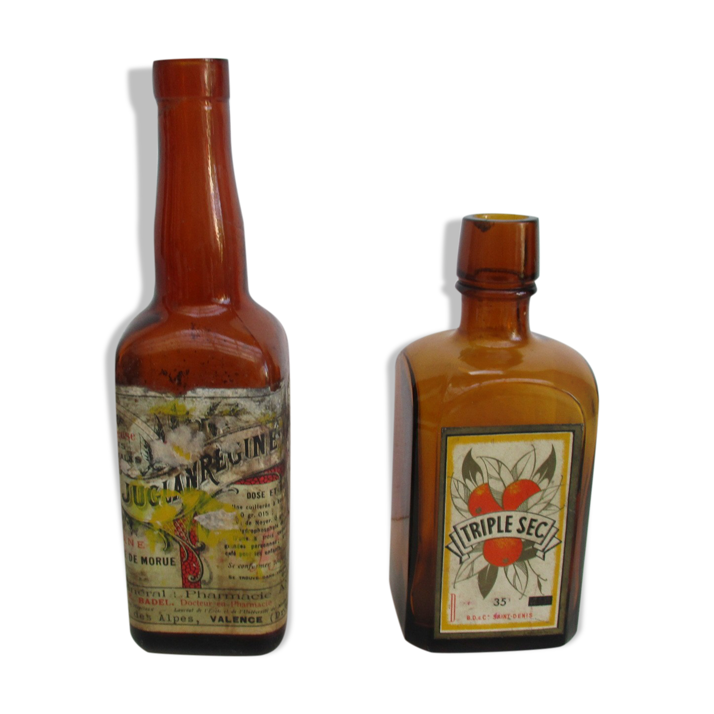 2 amber glass bottles with their old labels