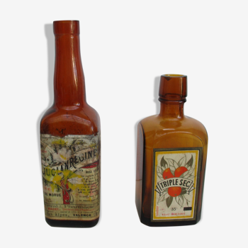 2 amber glass bottles with their old labels