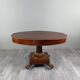 Oval Empire-style table with a central pedestal, 19th century.
