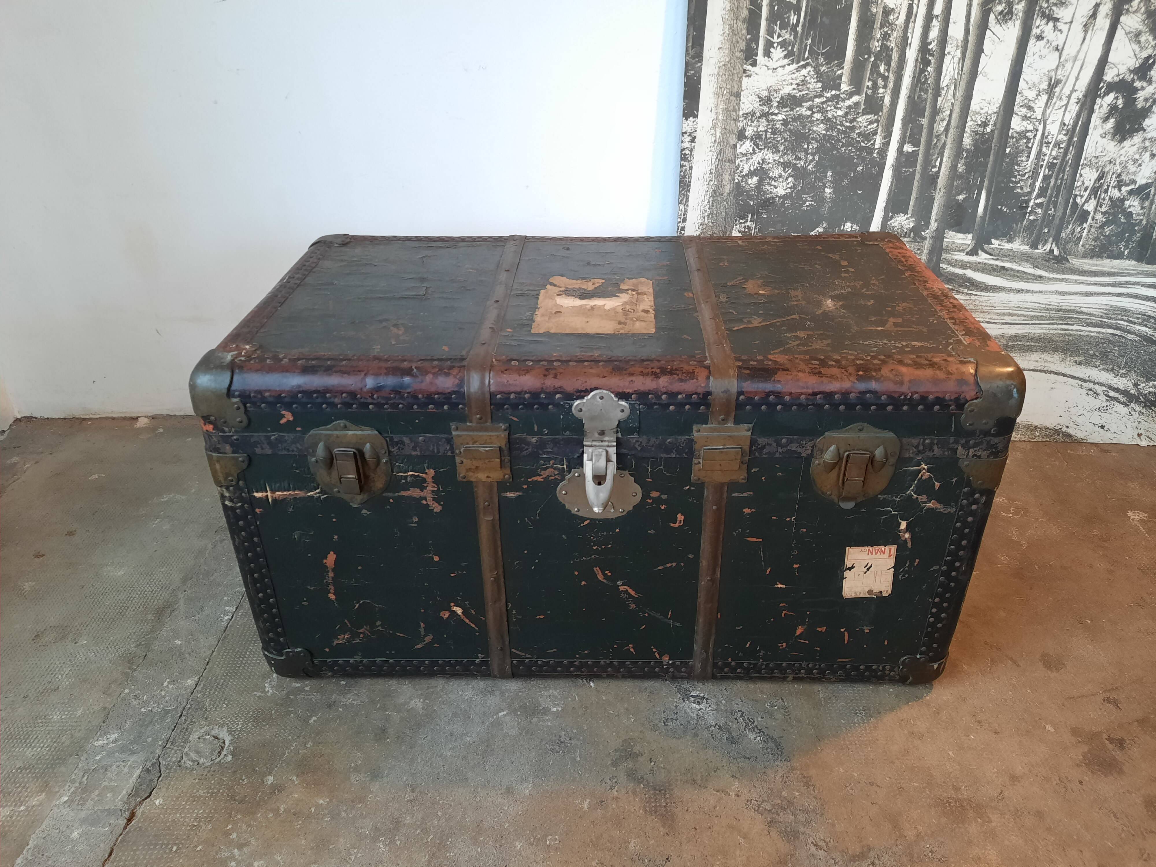 Old and large travel trunk, brass-plated corners