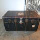 Old and large travel trunk, brass-plated corners