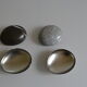 2 boxes in lithographed sheet metal in the shape of a pebble