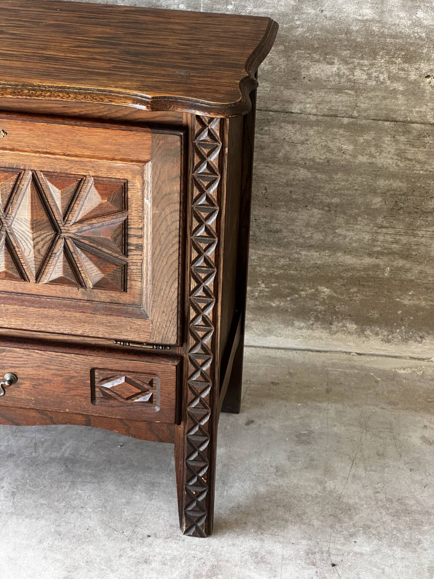 Small storage cabinet in carved oak – circa 1930