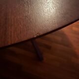 Round table made of solid wood with a walnut finish top.